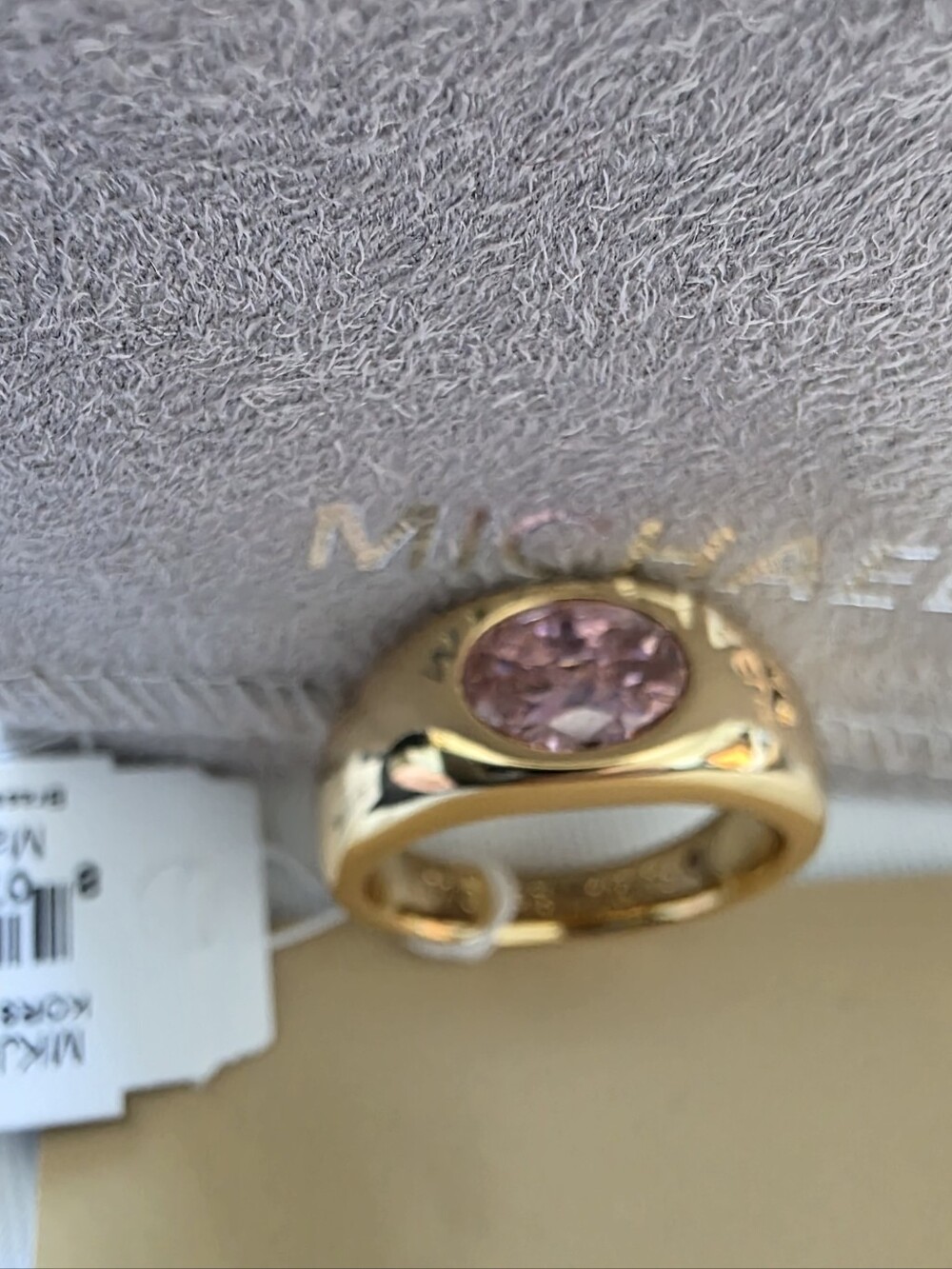 Michael Kors Gold Tone Band Ring with Pink Faceted Stone